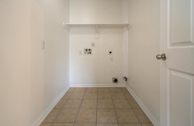 clothes washing area with electric dryer hookup, hookup for a gas dryer, and tile patterned floors