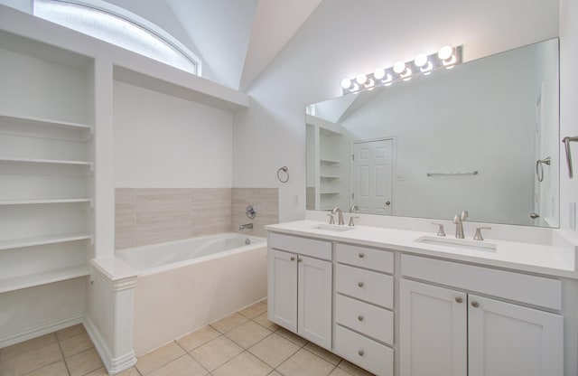 bathroom featuring tile patterned flooring, a bathtub, built in features, and lofted ceiling