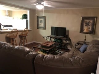 living room with ceiling fan