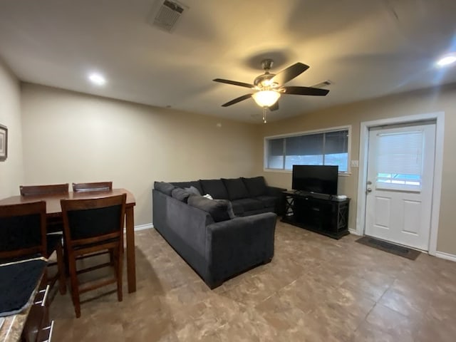 living room with ceiling fan