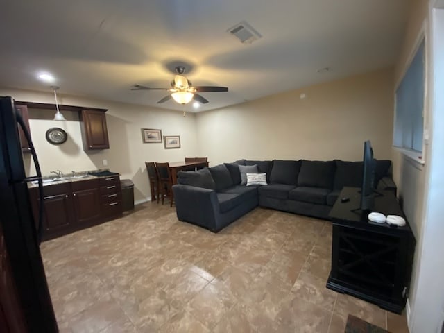 living room with ceiling fan