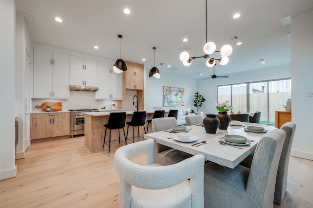 dining space with baseboards, visible vents, light wood finished floors, recessed lighting, and ceiling fan