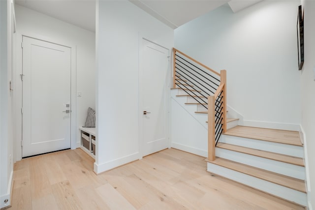 stairs with wood-type flooring