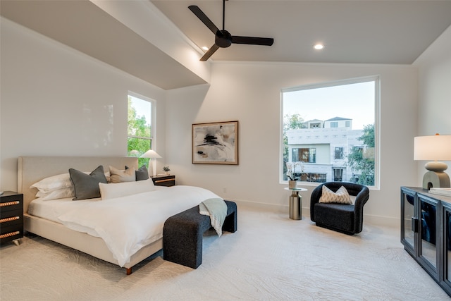 bedroom featuring carpet flooring, a ceiling fan, baseboards, and vaulted ceiling