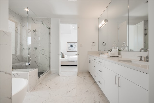 ensuite bathroom with a marble finish shower, double vanity, a freestanding bath, a sink, and marble finish floor