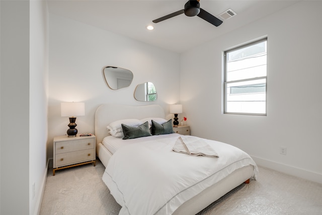 carpeted bedroom with a ceiling fan, recessed lighting, baseboards, and visible vents