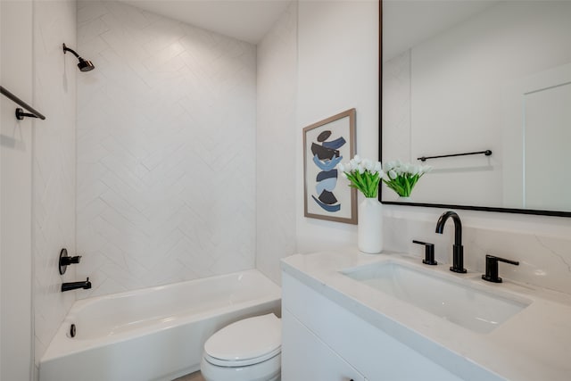 full bathroom featuring vanity, toilet, and tiled shower / bath combo