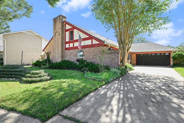 view of front of property with a garage and a front yard