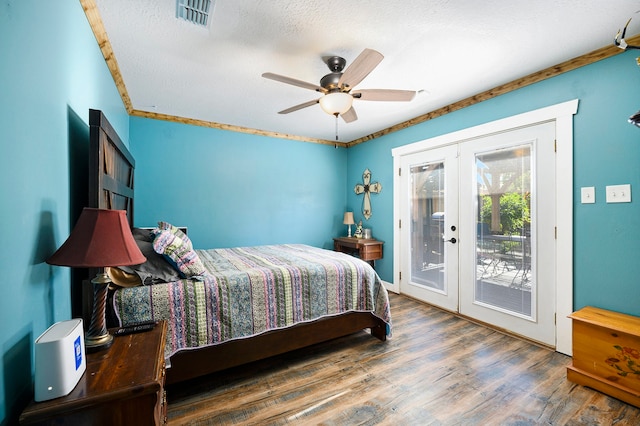 bedroom with hardwood / wood-style floors, french doors, ceiling fan, access to exterior, and a textured ceiling