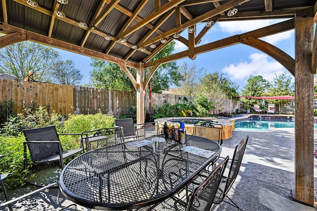 view of patio featuring a gazebo and a fenced in pool