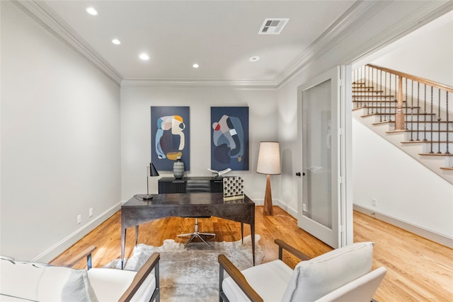 interior space featuring hardwood / wood-style flooring and crown molding