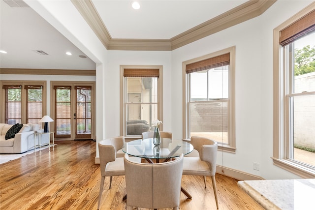 dining area featuring a healthy amount of sunlight and light hardwood / wood-style floors