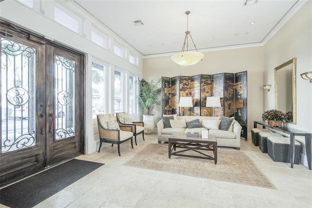 interior space featuring crown molding and french doors