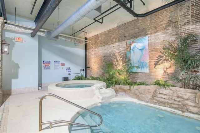 view of pool with an indoor in ground hot tub