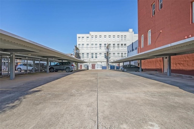 view of parking / parking lot featuring a carport