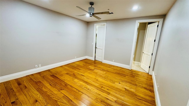 unfurnished bedroom with light hardwood / wood-style floors and ceiling fan