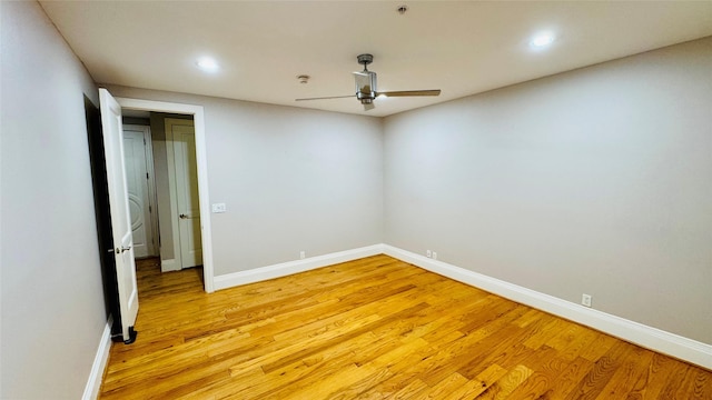 empty room with light hardwood / wood-style flooring and ceiling fan