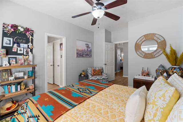 bedroom featuring ceiling fan and wood-type flooring