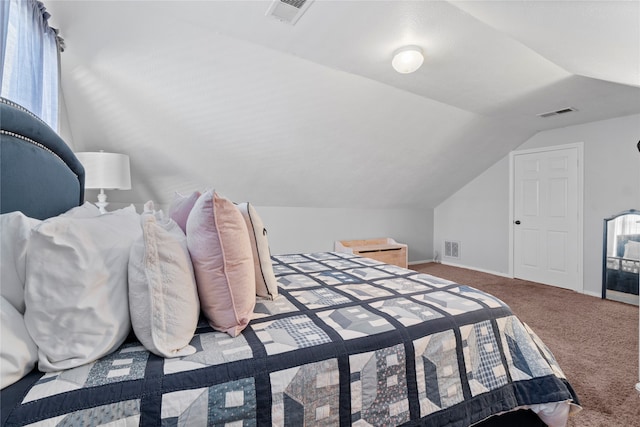 bedroom featuring carpet and lofted ceiling