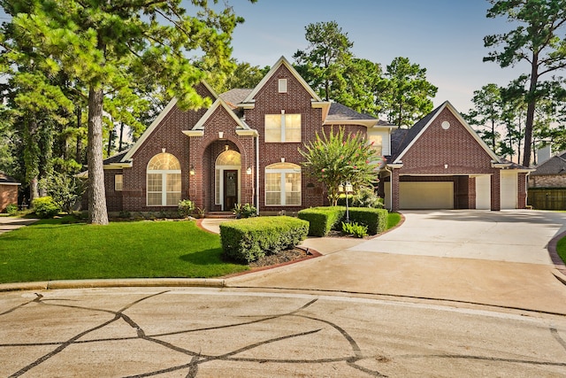 view of front facade with a front lawn and a garage