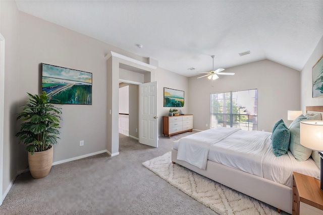 bedroom with light carpet, vaulted ceiling, and ceiling fan