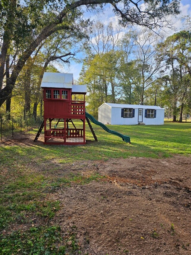 view of play area with a yard