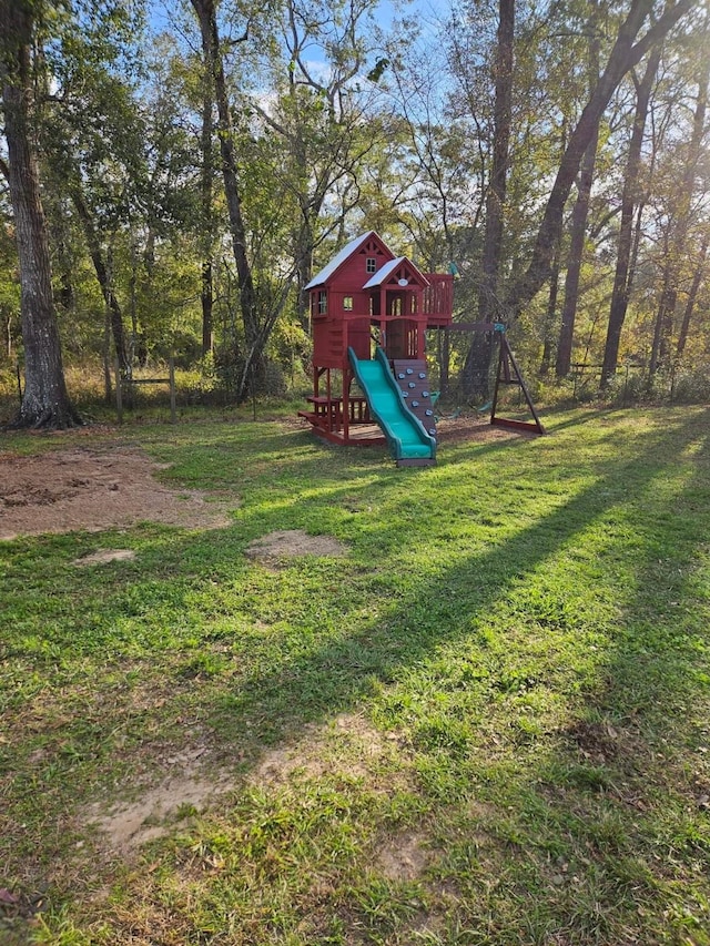 view of jungle gym with a yard