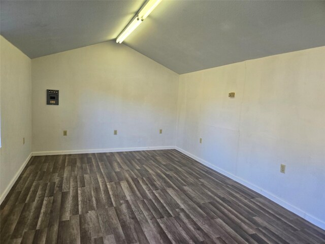 unfurnished room featuring lofted ceiling with beams and dark hardwood / wood-style floors