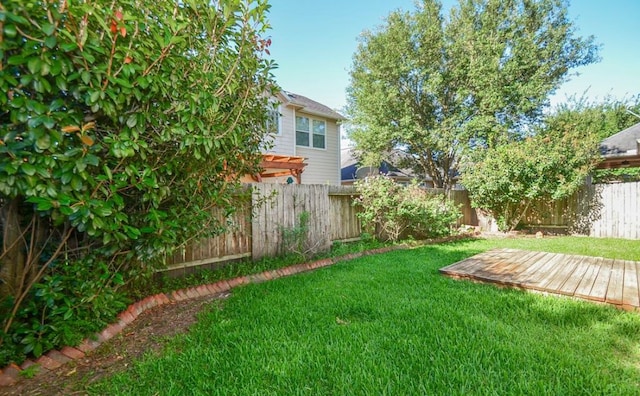 view of yard with a wooden deck