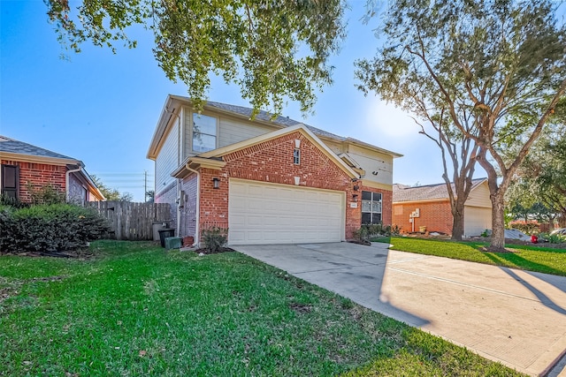 front of property with a front yard and a garage