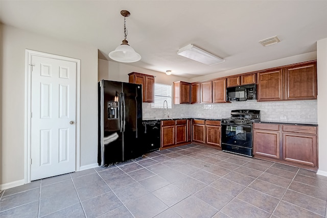 kitchen featuring black appliances, decorative light fixtures, decorative backsplash, and tile patterned flooring