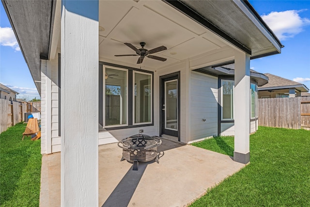 view of patio / terrace with a fire pit and ceiling fan