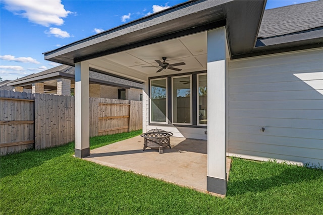 view of patio with a fire pit and ceiling fan