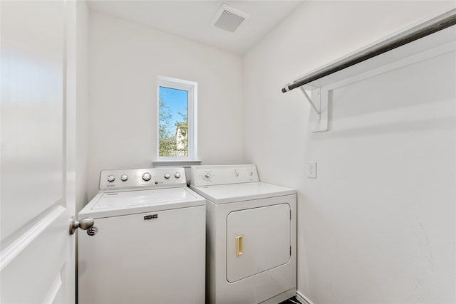 washroom featuring washing machine and dryer