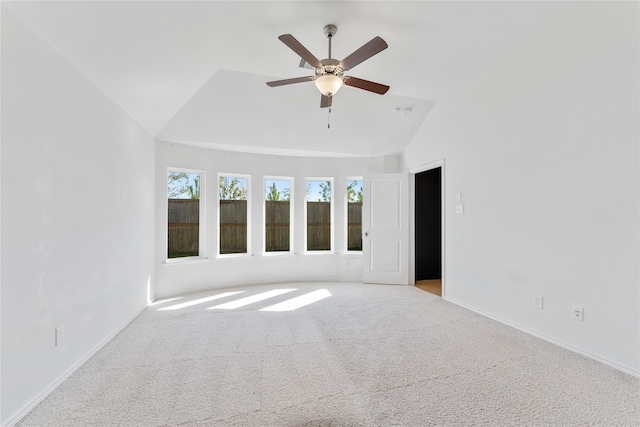 unfurnished room with ceiling fan, light carpet, and vaulted ceiling