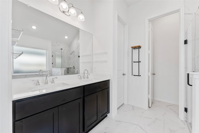 bathroom with vanity and a shower with shower door