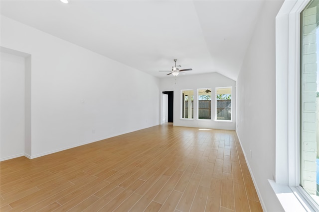 unfurnished living room with ceiling fan, light hardwood / wood-style floors, and lofted ceiling