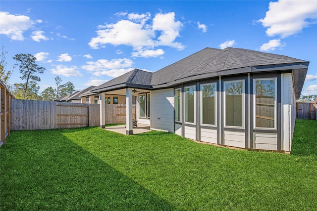 back of property featuring a patio area and a yard