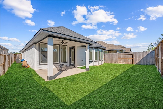 rear view of house with a lawn, a patio area, ceiling fan, and cooling unit