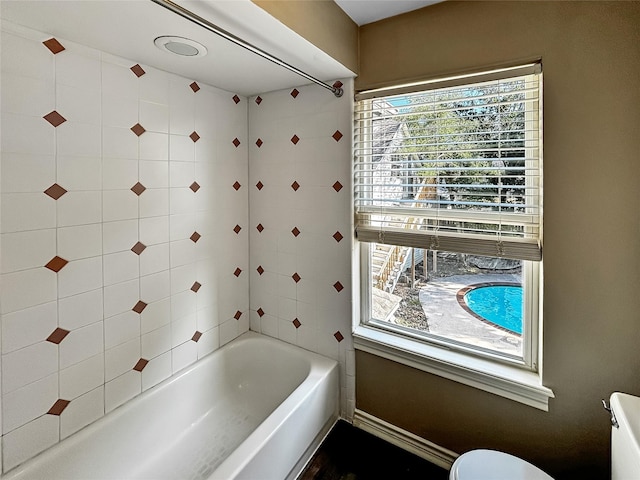 1519 Hannington Dr, Katy, TX 77450 - bathroom with toilet, shower / bath combination, and baseboards