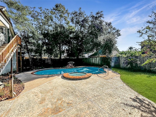 1519 Hannington Dr, Katy, TX 77450 - view of swimming pool featuring a fenced backyard, a patio area, and a pool with connected hot tub