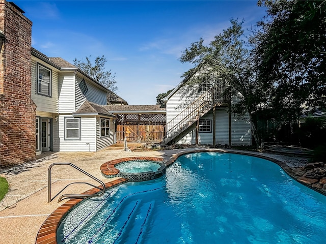 1519 Hannington Dr, Katy, TX 77450 - view of pool featuring stairs, a patio area, and a pool with connected hot tub