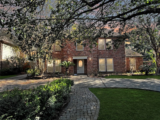 view of front of home with a lawn