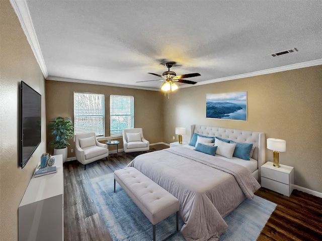 bedroom with a textured ceiling, dark hardwood / wood-style flooring, ceiling fan, and crown molding