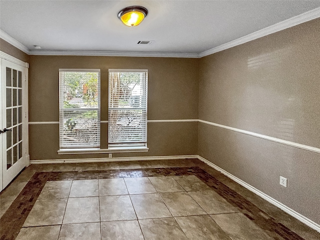 interior space with french doors, tile patterned floors, and ornamental molding