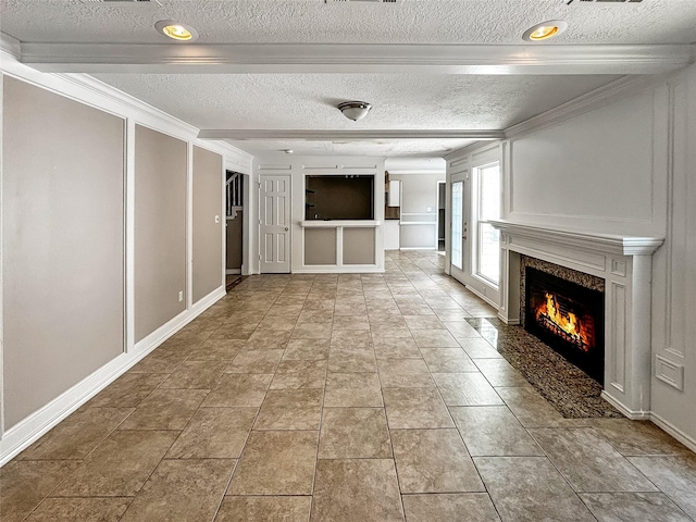 1519 Hannington Dr, Katy, TX 77450 - corridor featuring a textured ceiling, crown molding, a decorative wall, and baseboards