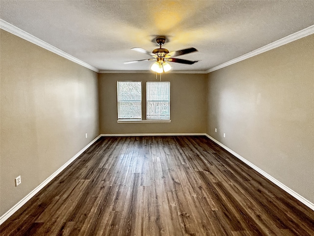 spare room with a textured ceiling, crown molding, and dark wood-type flooring