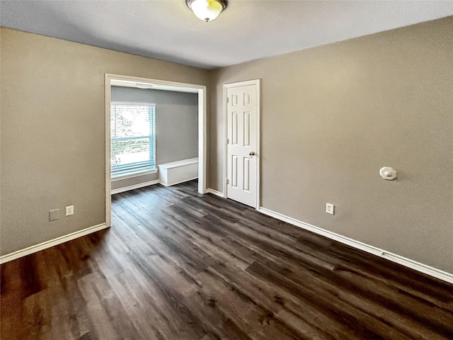 1519 Hannington Dr, Katy, TX 77450 - spare room with dark wood-style flooring and baseboards