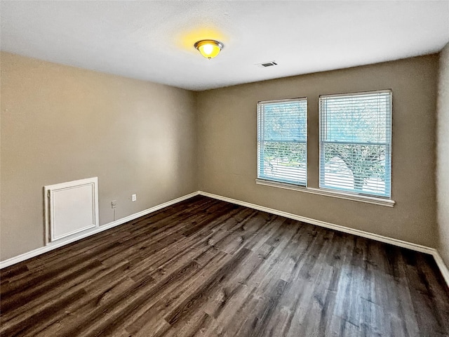 1519 Hannington Dr, Katy, TX 77450 - unfurnished room with baseboards and dark wood-style flooring