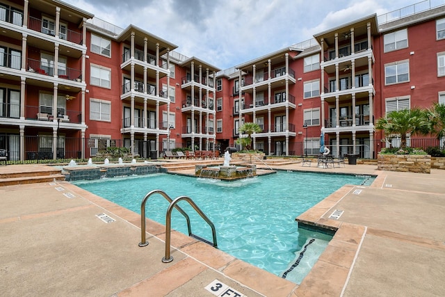 view of swimming pool featuring pool water feature